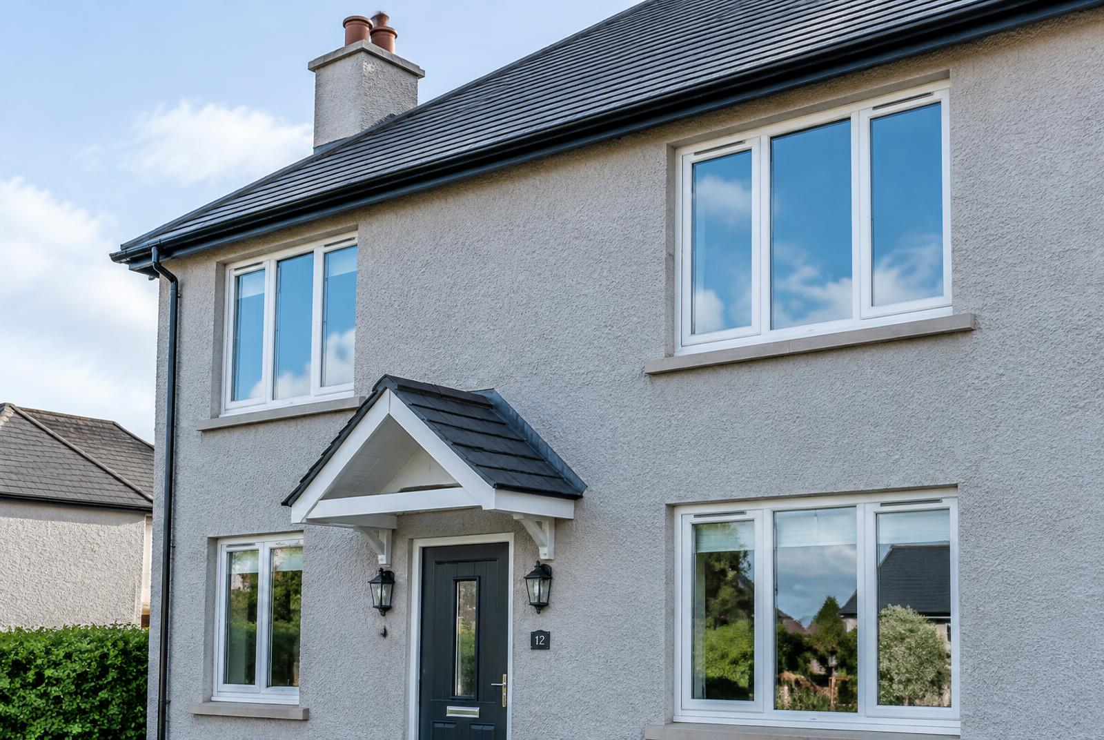 Gleaming clean windows on a rendered house in Northern Ireland